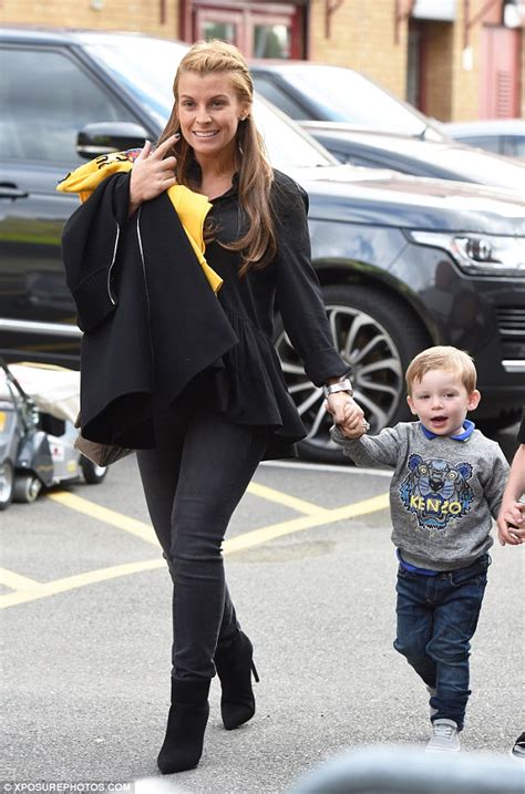 Pregnant Coleen Rooney Hides Her Baby Bump As She Holds Hands With Son