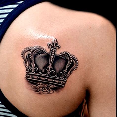 A Woman S Shoulder With A Crown Tattoo On Her Left Side Ribcage