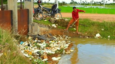 Unclogging Culverts. - YouTube