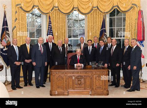 U.S. President Donald Trump poses with the former leaders of the U.S ...