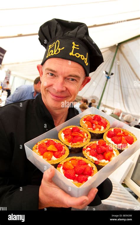 Stall Holder With Desserts At Ludlow Food Festival Shropshire Stock