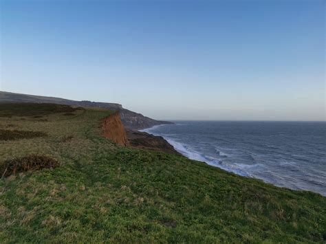 Rock Cliff Near Seashore · Free Stock Photo