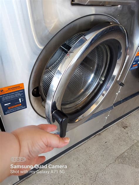 Time to start the clean cycle, chubby hands make the job easier