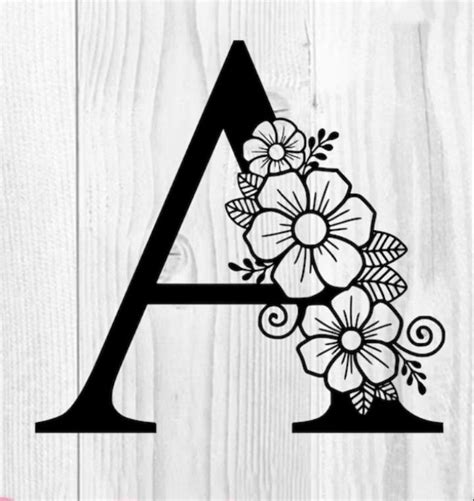 The Letter With Flowers On It Is Cut Out To Make A Flower Monogramment