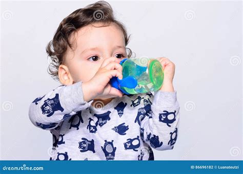 Portrait of a Cute Toddler Drinking Water from the Bottle. Stock Photo ...