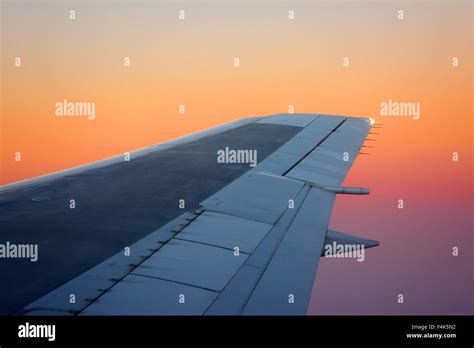 Airplane Wing On Sunset Stock Photo Alamy