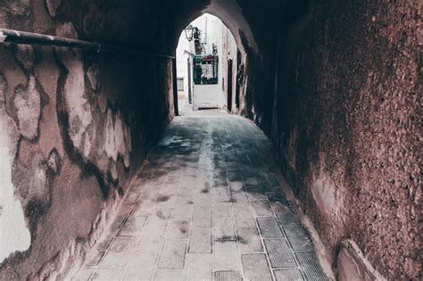 Premium Photo Narrow Alley Amidst Buildings