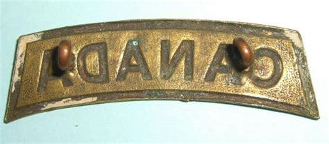 The Quartermaster S Store WW1 Canada Brass Shoulder Title