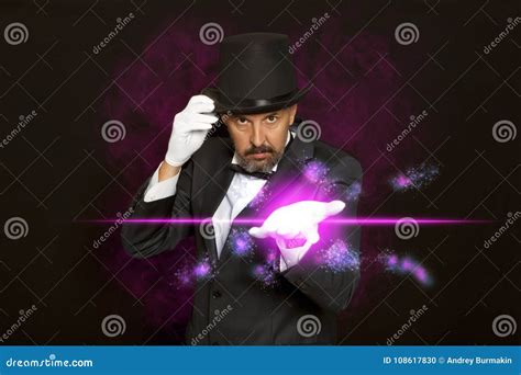 Magician in Top Hat Showing Trick on Black Stock Photo - Image of ...