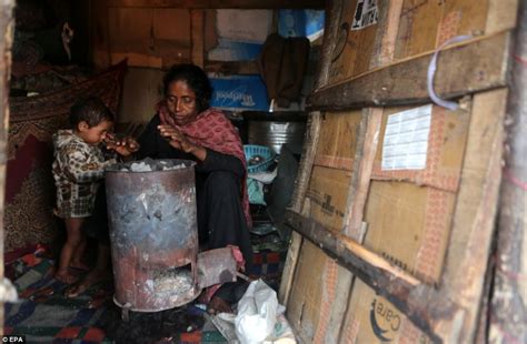 Amid Cardboard Homes Srinagars Poor Shiver Around Makeshift Fires