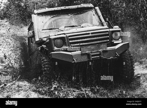 Mud And Water Splash In Off Road Racing Offroad Vehicle Coming Out Of