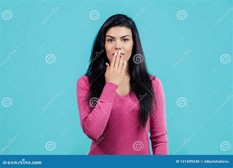 Close Up Portrait Of Pretty Girl Closing Her Mouth With Hand Stock