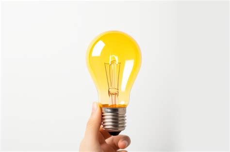 Premium Photo Person Holding Light Bulb On A White Or Clear Surface