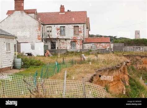 Sea Cliff Collapsing Into The Sea Due To Coastal Erosion In Happisburgh