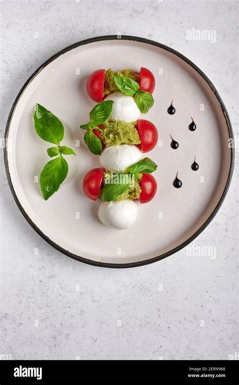 Vertical Orientation Delicious Italian Caprese Salad With Ripe Tomatoes