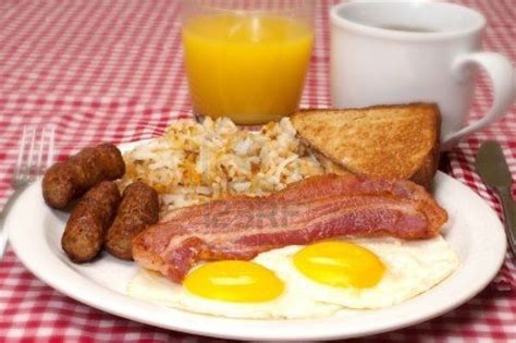 Breakfast Plate With Eggs Sunny Side Up Bacon Link Sausage Hash Browns Toast Coffee And