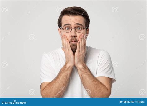 Millennial Caucasian Man In Glasses Feel Astonished Or Shocked Stock