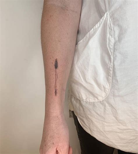 Micro Realistic Arrow Tattoo Located On The Forearm