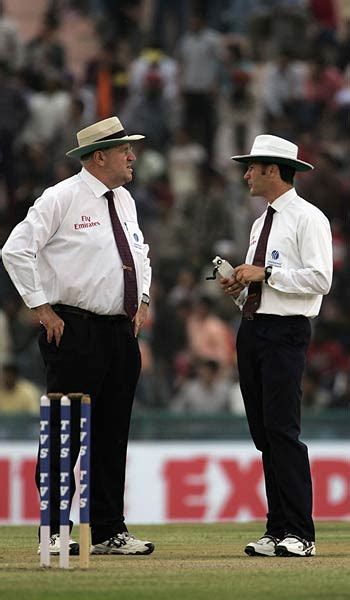 Umpires Darrell Hair And Simon Taufel Have A Talk About The Light