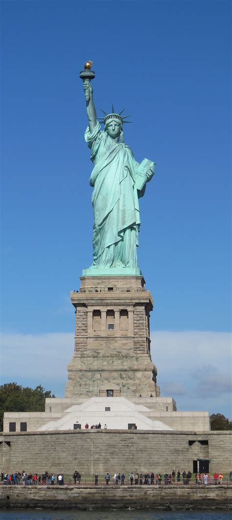 Til The Statue Of Liberty Has At Her Feet A Broken Shackle And Chain As