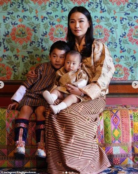 Prince Jigme Namgyel of Bhutan cuddles up with Prince Jigme Ugyen in an ...