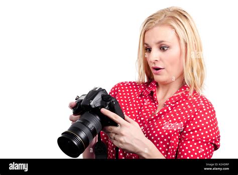 A Pretty Blonde Woman Photographer With Her Camera On White Stock