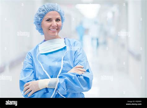 Female surgeon in scrubs smiling, portrait Stock Photo - Alamy