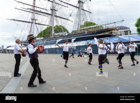 Morris Dancers In Front Of Cutty Sark Clipper Ship In Greenwich London