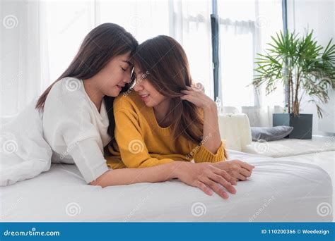 Asia Lesbian Lgbt Couple Hug And Lay On Bed Near White Window Sunlight With Happiness Moment