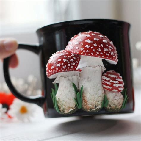 A Coffee Mug With Mushrooms Painted On It