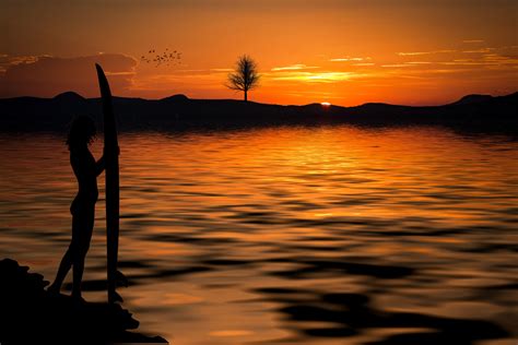 Sunset On The Beach With Surfer Girl Image Free Stock Photo Public