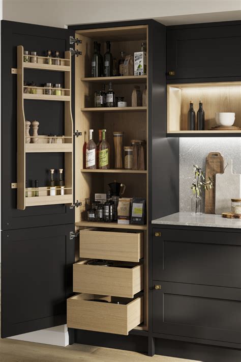 an open cabinet in a kitchen filled with lots of items