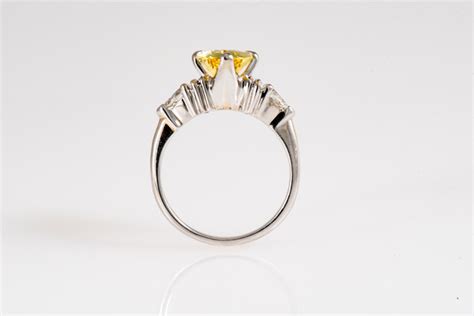 Golden Chrysoberyl Engagement Ring With Pear Diamond Accents