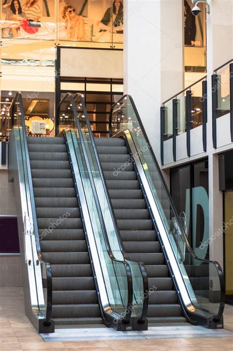 Escalator in a shopping mall, UK — Stock Photo © kk_tt #26482079