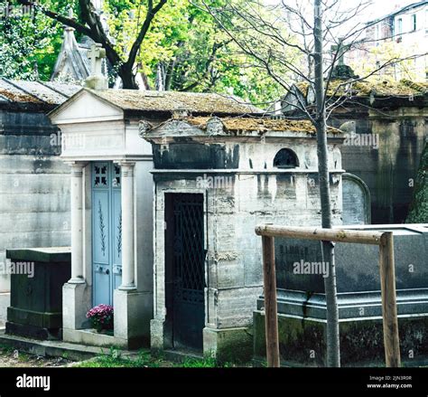 Tombstones In Cemetery At Dusk Gothic Style Crosses Paris Stock Photo