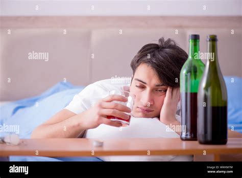 The Man Alcoholic Drinking In Bed Going Through Break Up Depression