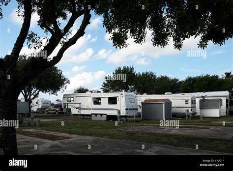 Travel Trailers Fifth Wheels Mobile Homes And Park Models Sit Serenely In A Trailer Park Rv