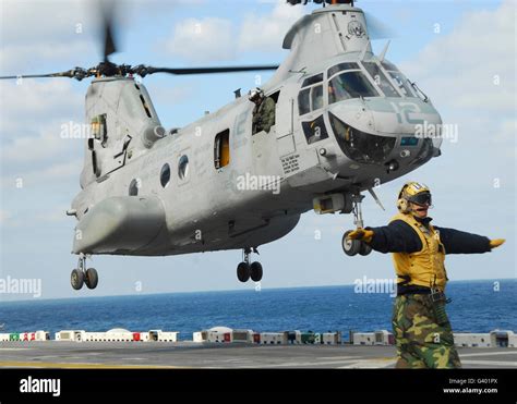 A CH 46E Sea Knight Helicopter Takes Off From The Flight Deck Of USS