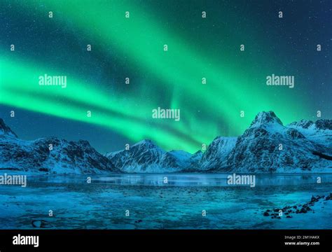 Aurora Borealis Over Snowy Mountains Frozen Sea Coast Stock Photo Alamy