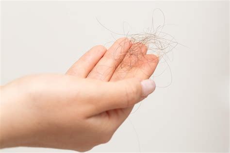 Premium Photo Detail Of A Hand Of Woman With Fallen Hair