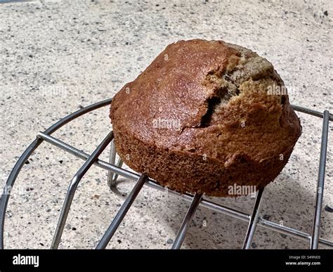 A Banana Muffin Cooling On A Wire Rack After Being Baked In An Air