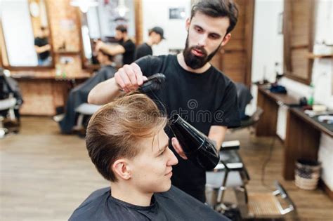 Man Getting Trendy Haircut At Barber Shop Stock Photo Image Of