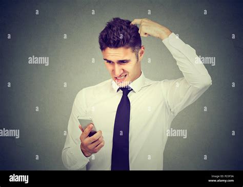 Clueless Confused Business Man Having Troubles With His Smartphone