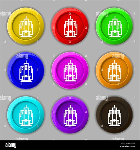 L icône de gratte ciel signe symbole sur neuf boutons colorés Vector