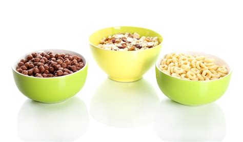 Premium Photo | Delicious and healthy cereal in bowls isolated on white