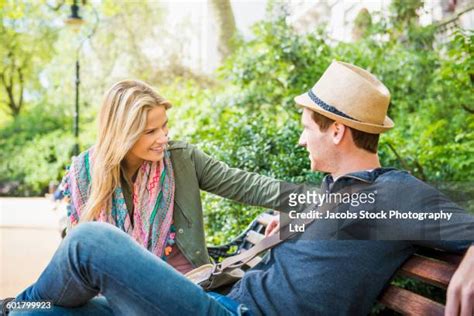 Couple Talking On Park Bench Photos And Premium High Res Pictures Getty Images