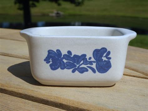 A Blue And White Bowl Sitting On Top Of A Wooden Table