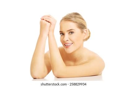 Portrait Nude Woman Clenching Hands Sitting Stock Photo