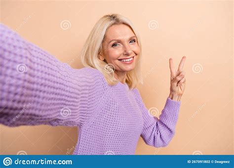 Photo Of Cheerful Optimistic Mature Lady With Blond Hairdo Wear Knit