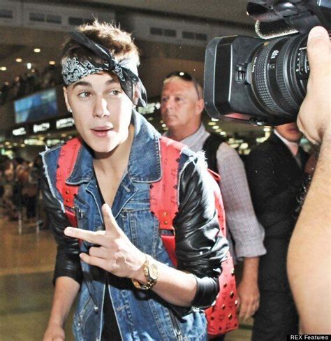 Justin Bieber Channels Tupacs Style At Airport With Selena Gomez